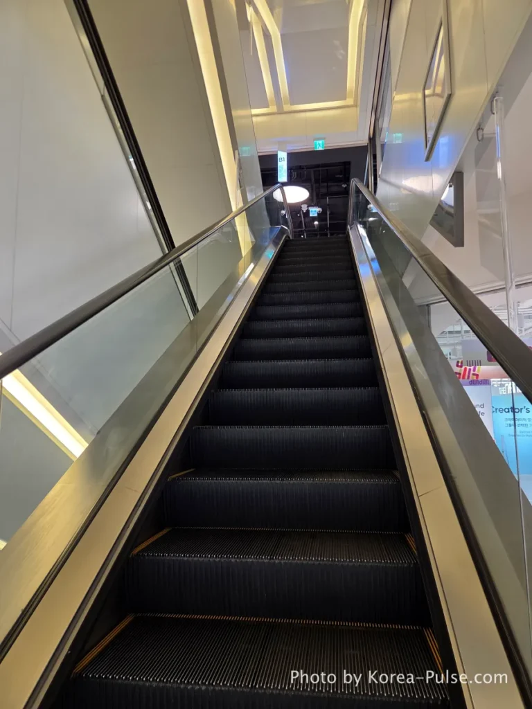 DUNDUN Dongdaemun floor guide sign and escalator interior showing all 8 floors in DUNDUN Dongdaemun