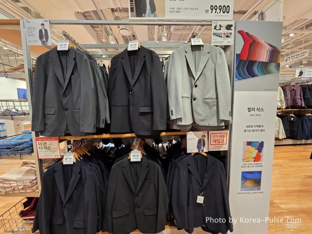 Uniqlo store interior at DUNDUN Dongdaemun 1st floor showing UT graphic tees blazers and full collection