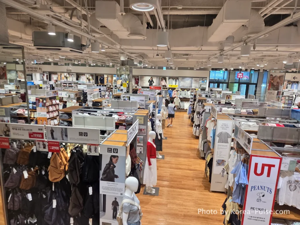 Uniqlo store interior at DUNDUN Dongdaemun 1st floor showing UT graphic tees blazers and full collection