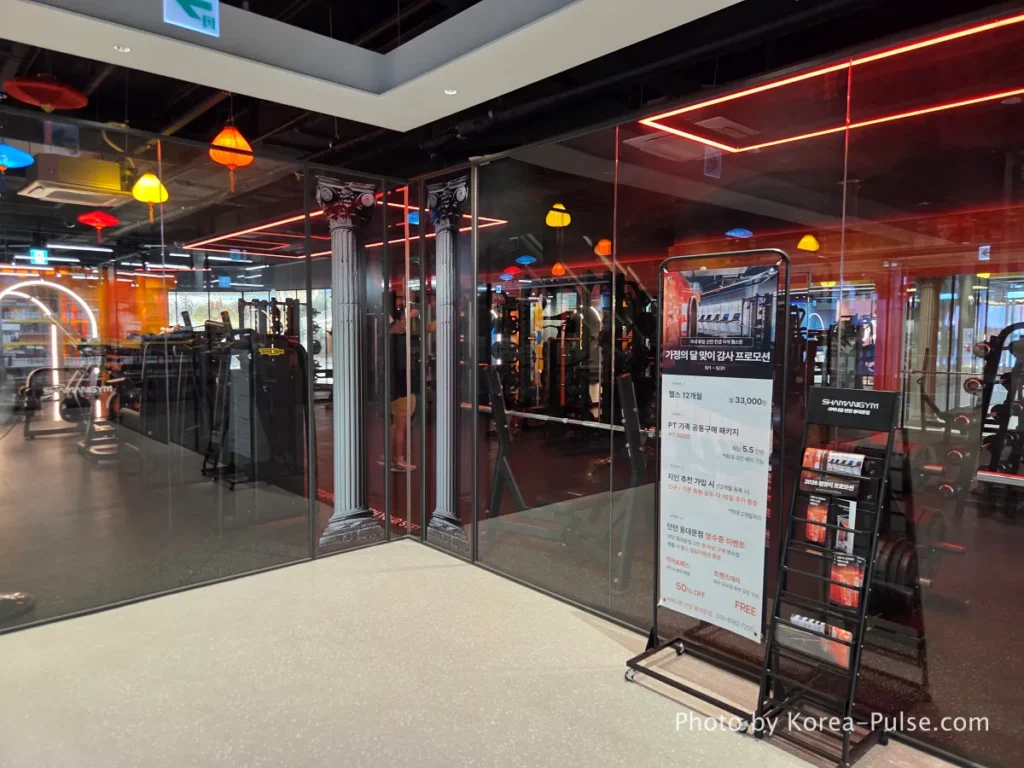 Shamani Gym fitness center entrance at DUNDUN Dongdaemun 6th floor with Roman column interior design and red neon lighting