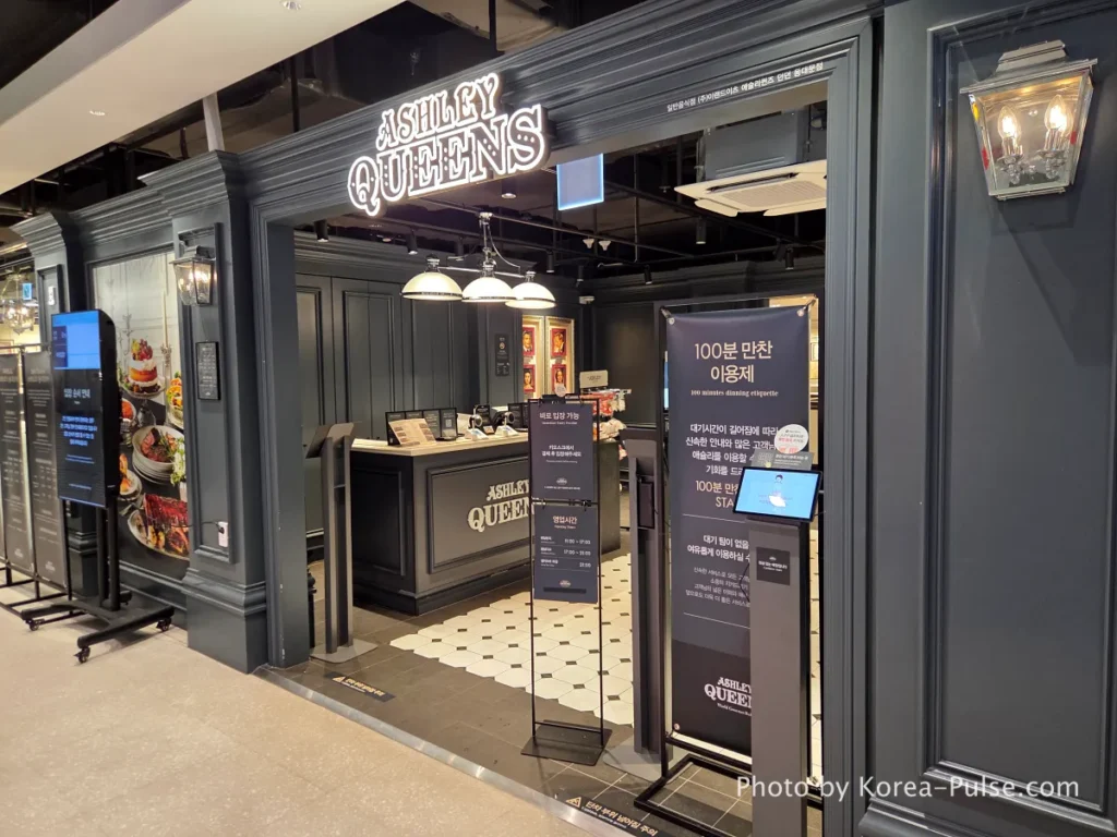 Ashley Queens family buffet restaurant entrance and crowded packed dining hall on 7th floor DUNDUN Dongdaemun