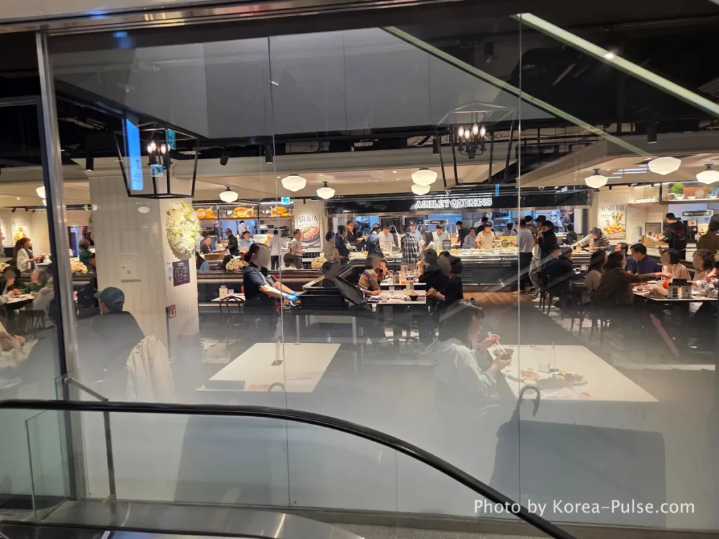 Ashley Queens family buffet restaurant entrance and crowded packed dining hall on 7th floor DUNDUN Dongdaemun
