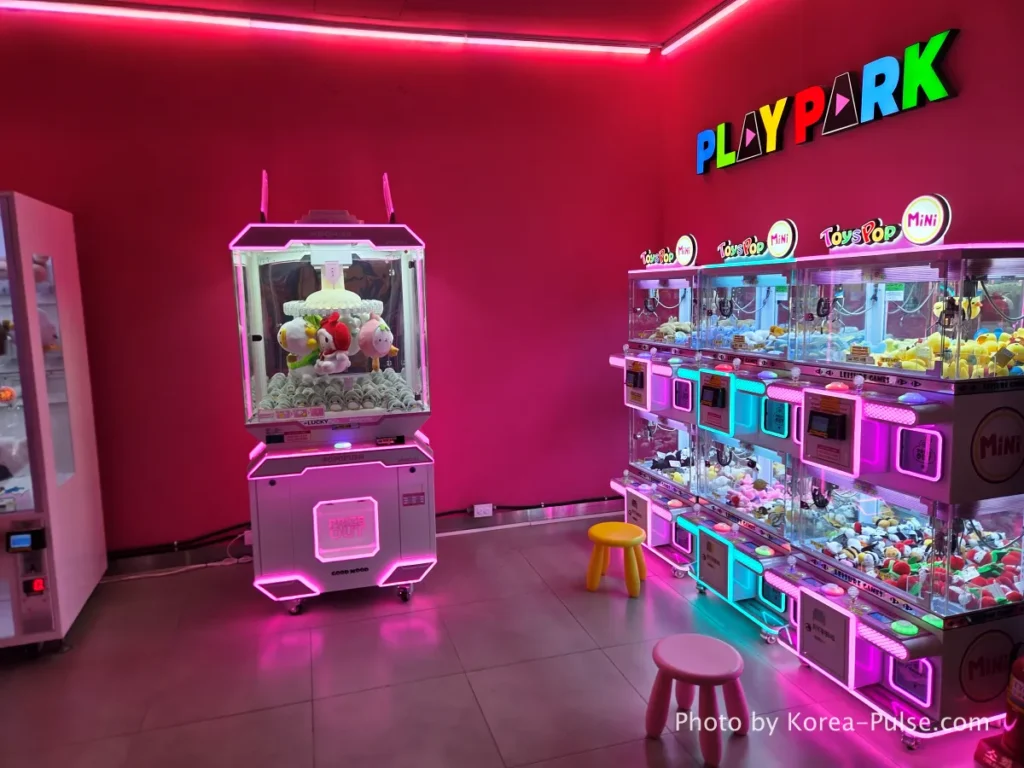 8th floor restaurant area and colorful neon claw machine Ppobgi arcade at DUNDUN Dongdaemun Seoul