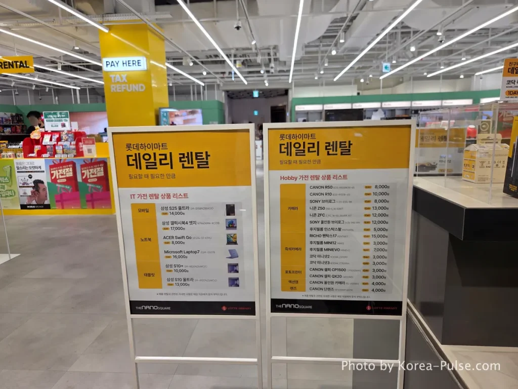 Daily Rental pricing board at DUNDUN Dongdaemun showing 2026 daily rental fees for cameras lenses laptops and electronics