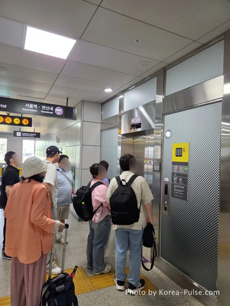 "Passengers queuing and waiting in line for the deep underground elevator at GTX-A Daegok Station