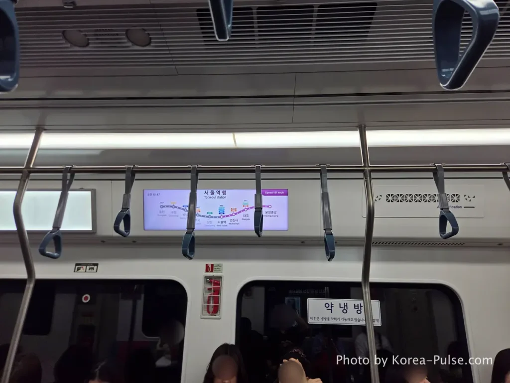 Digital route map display inside GTX-A train car showing Seoul Station bound service