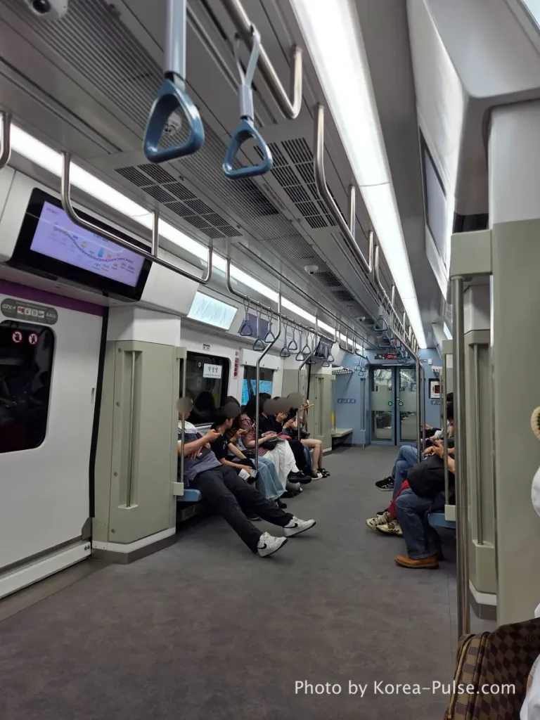 Quiet and uncrowded seating area inside the GTX-A train car with ample elbow room