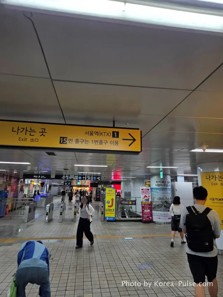 Underground directional signage at Seoul Station pointing toward KTX Exit 1 after arriving on GTX-A