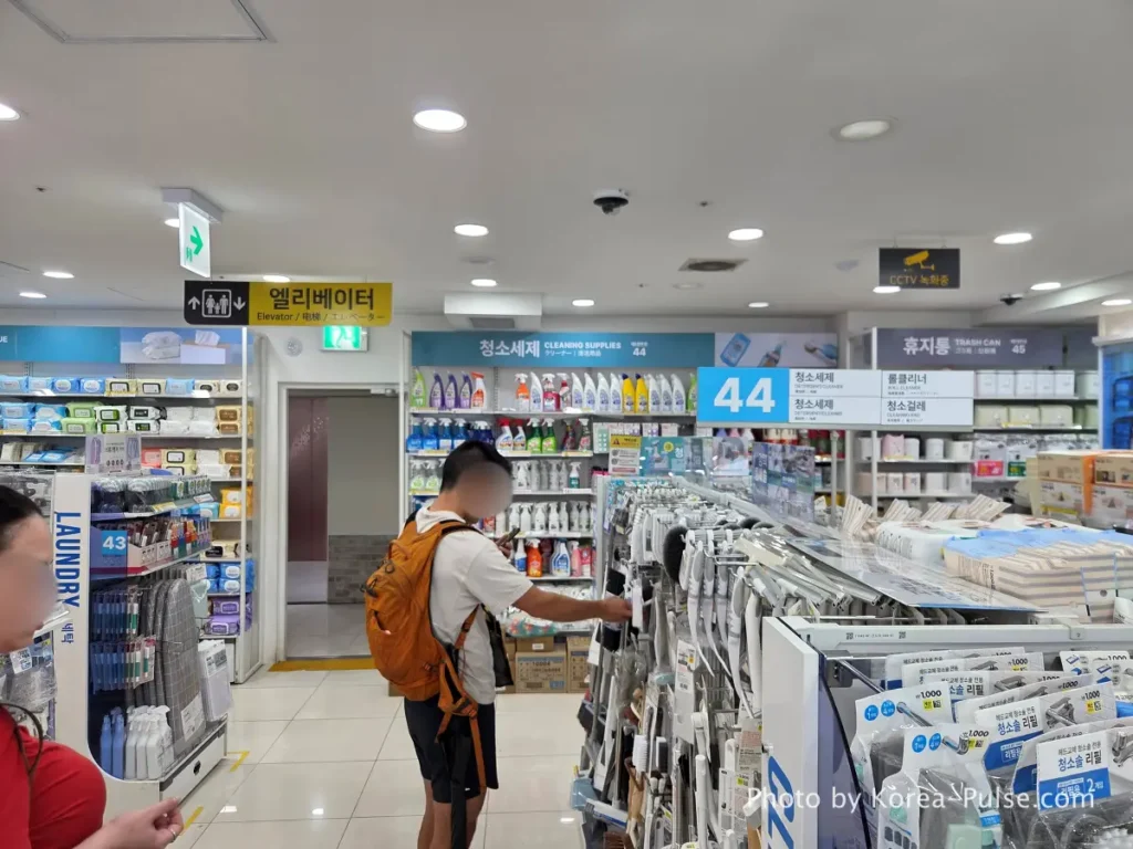 Daiso Myeongdong, Floor by FloorA 12-Story Shopping Survival Guide 20 Cleaning supplies bathroom products and laundry items display aisle on 8th floor Daiso Myeongdong Station branch Seoul