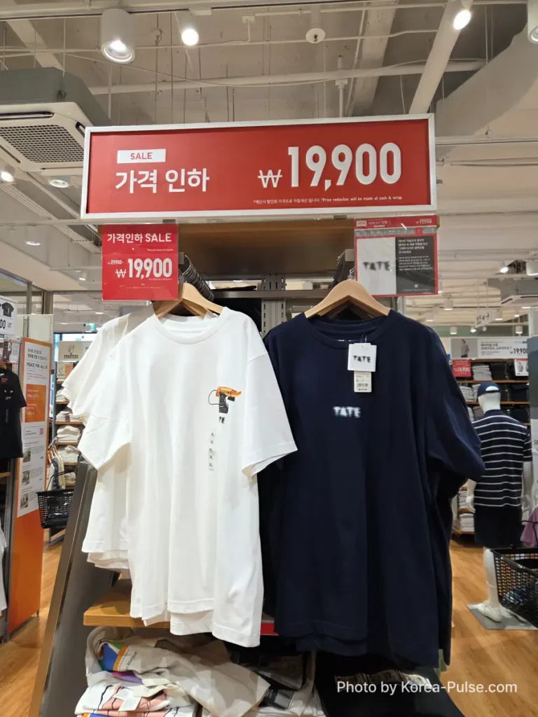 Uniqlo Thank You Festival in Seoul: I Went for One Thing and Bought Another (No Regrets) 6 Uniqlo UT graphic t-shirts from the Tate Museum collaboration on display in Seoul, with a red 가격 인하 SALE sign showing the reduced price of 19,900 won