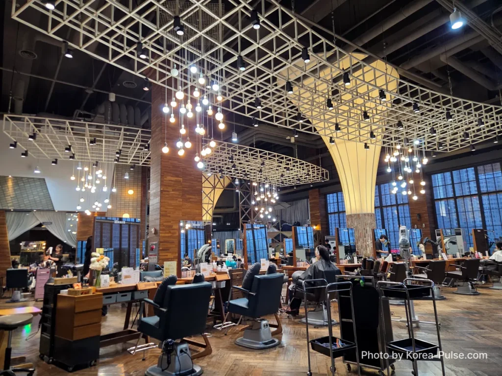 Interior of idHAIR One Mount beauty complex in Goyang showing soaring ceilings and luxury styling floor
