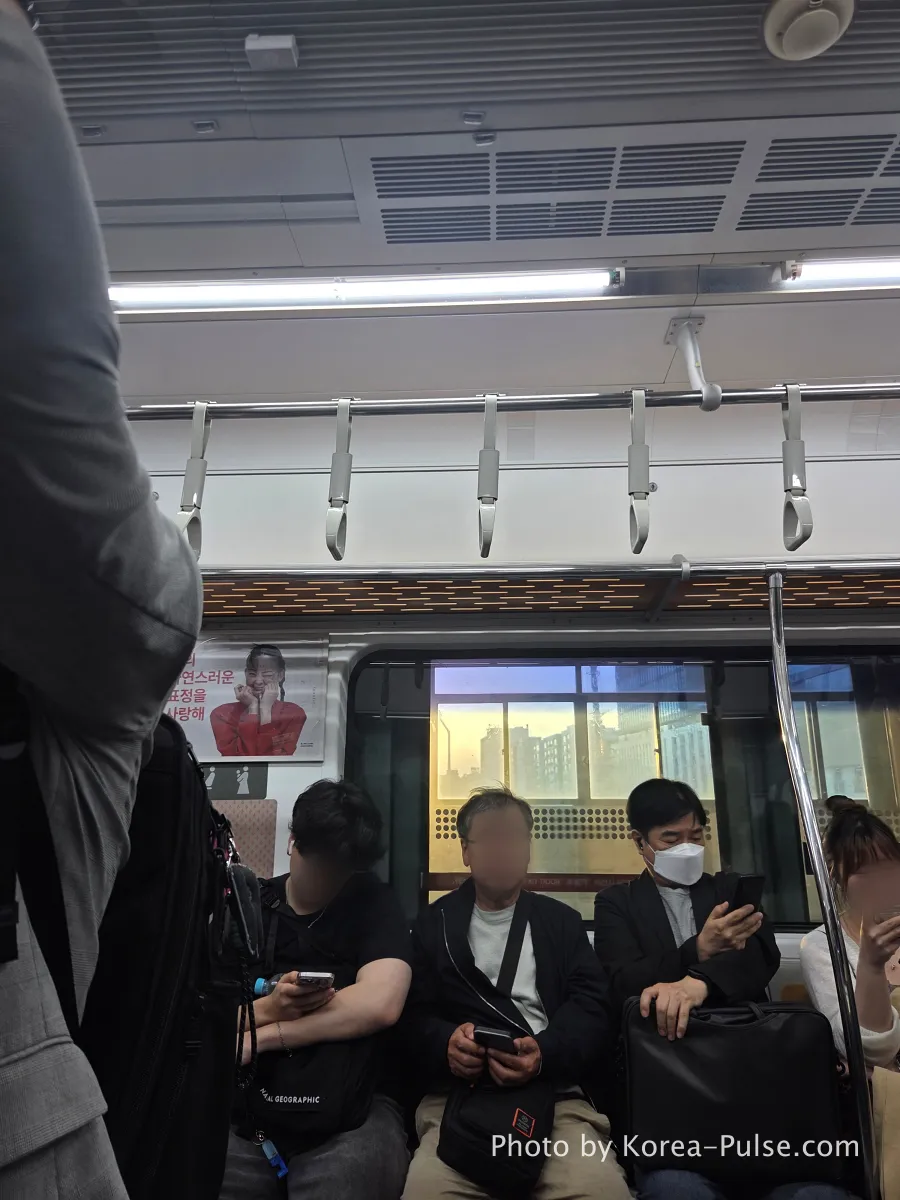 seoul metro commuters golden hour window