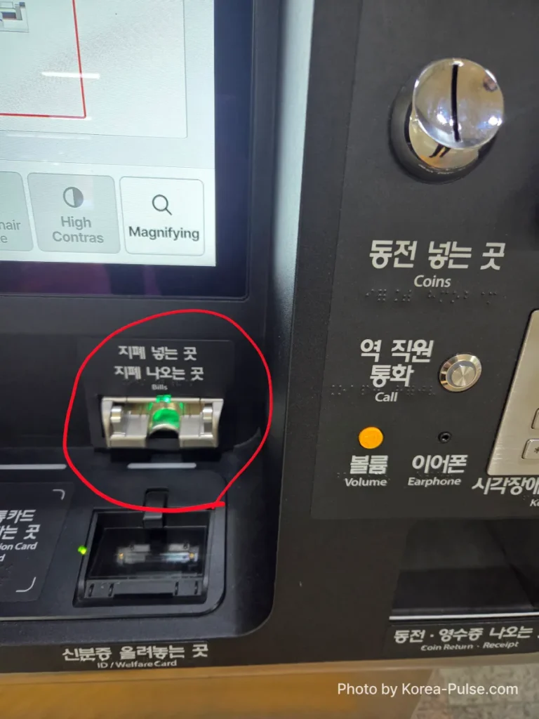 Seoul Metro ticket machine coin insertion slot highlighted with red circle annotation — paying cash for a Seoul subway single journey ticket
