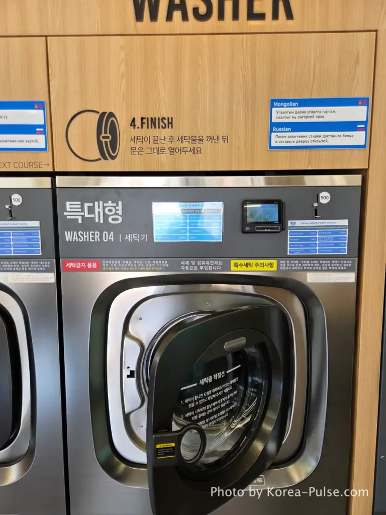 Coin Laundry in Korea: The Local's Complete Guide to 빨래방 10 Open washing machine drum door at Easy Wash Korean coin laundry after cycle completed demonstrating the unwritten rule to leave door open after use