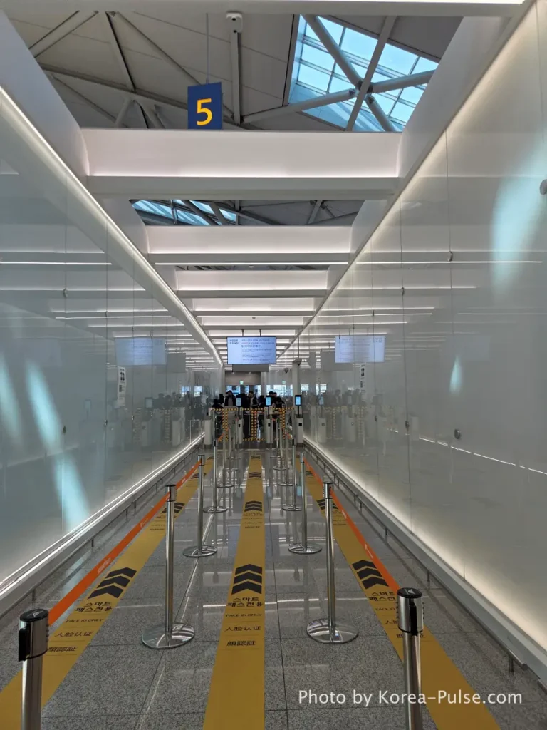 Incheon Airport Smartpass dedicated departure lane completely empty with yellow gate barriers at Terminal 1