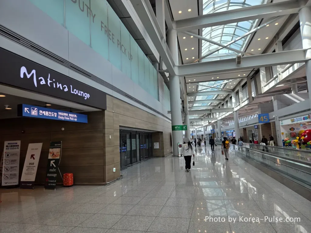 Incheon Airport airside duty-free corridor with Matina Lounge sign visible at Terminal 1 Gate 45 area