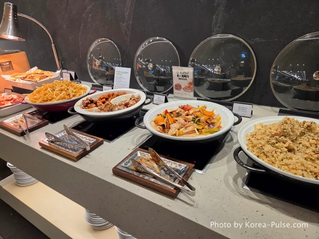 SKYHUB Lounge buffet spread at Incheon Airport with stir-fried rice grilled duck chicken and side dishes