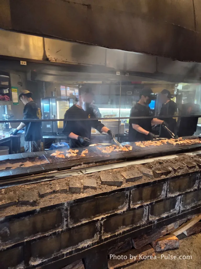 Dalmaji Plaza BBQ charcoal grill workers grilling chicken and sausages Euljiro Seoul