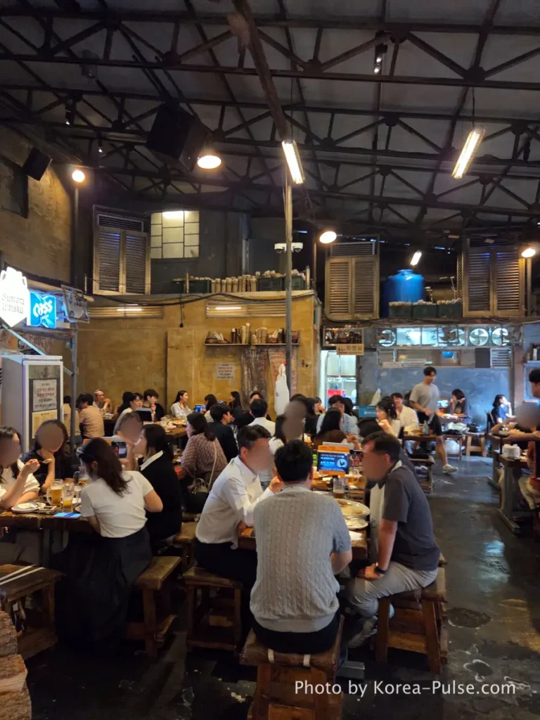 Dalmaji Plaza BBQ indoor seating packed with diners Euljiro Seoul Friday evening