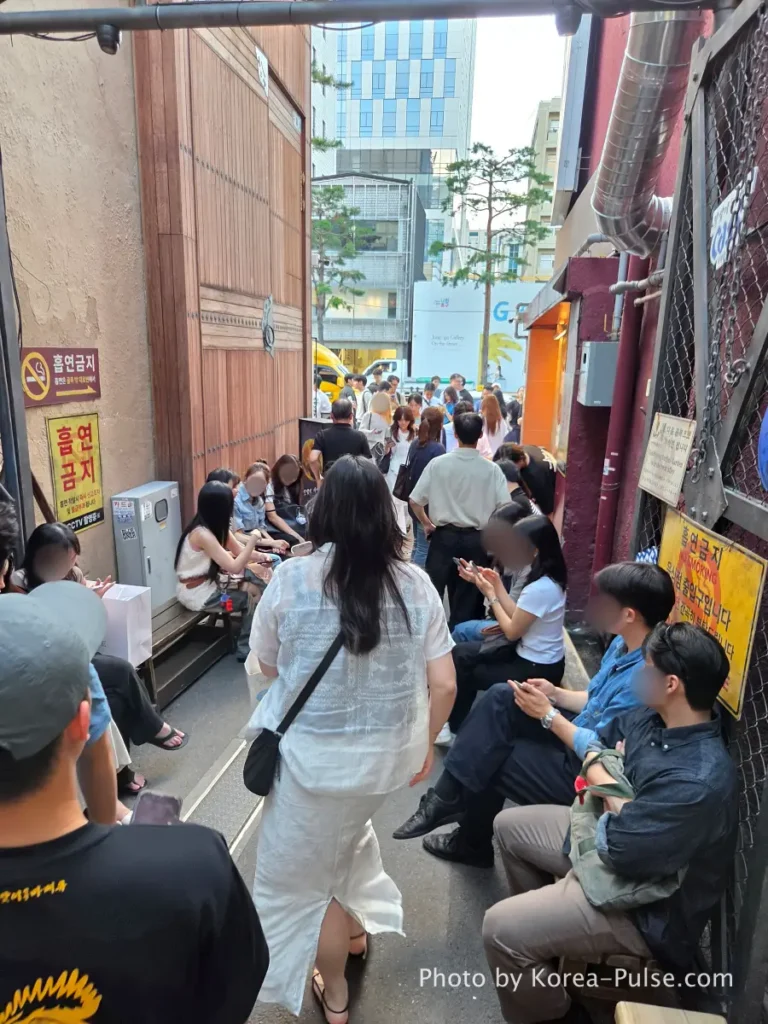 People waiting in line outside Dalmaji Plaza BBQ Euljiro yajang Seoul