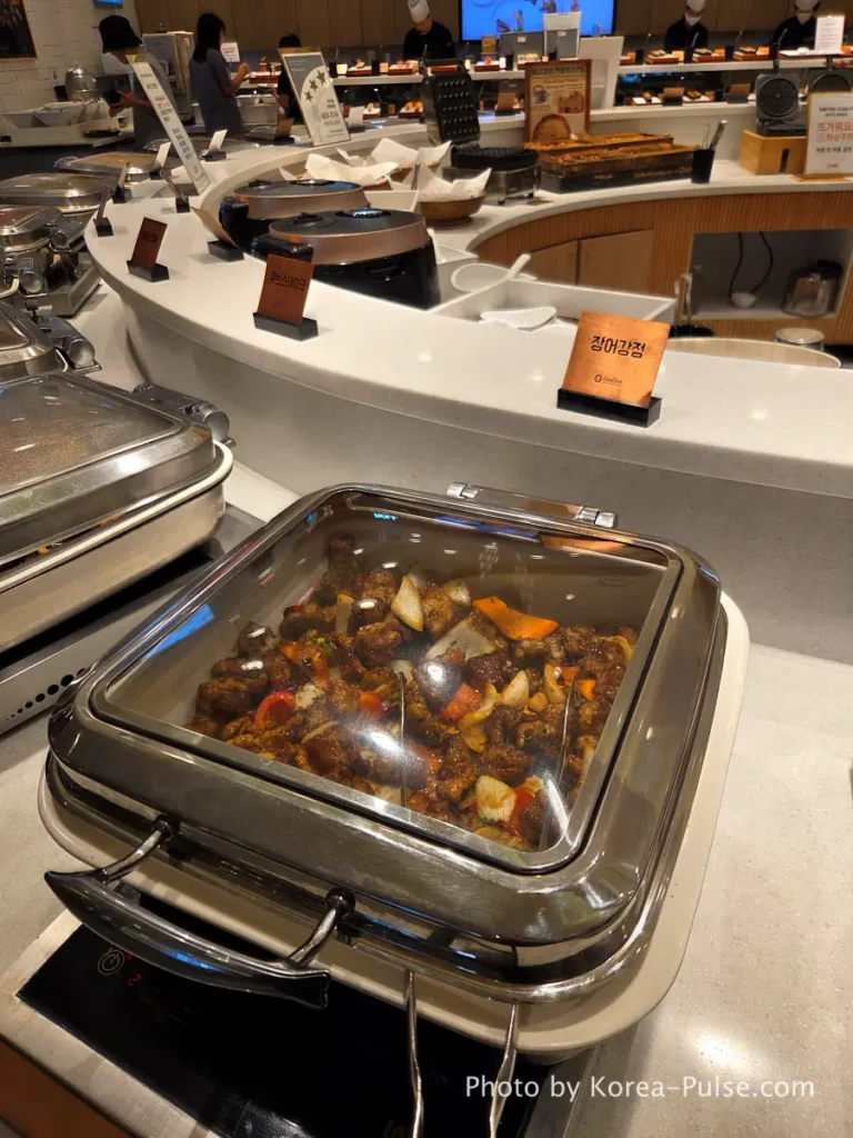 The 120-Dish Question: Inside QooQoo, Korea's Sushi Buffet Phenomenon 7 Eel gangjeong cube steak and LA galbi trays at QooQoo buffet