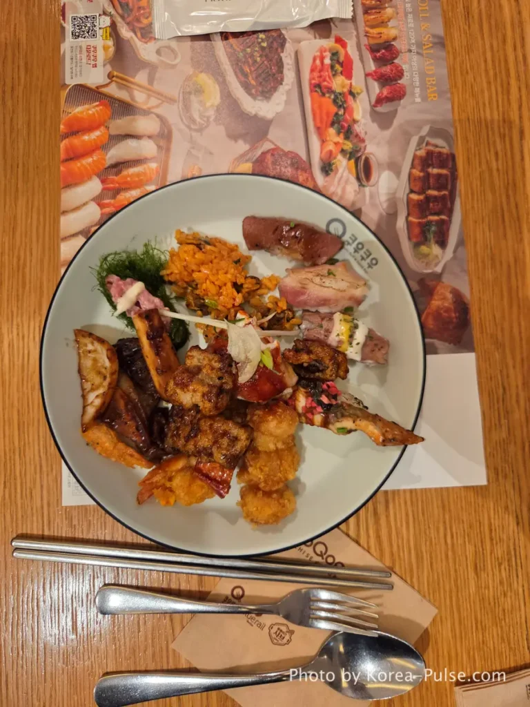 The 120-Dish Question: Inside QooQoo, Korea's Sushi Buffet Phenomenon 20 First plate with fried dishes sushi and samples at QooQoo Korean buffet